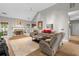 Spacious living room with vaulted ceiling, hardwood floors, stone fireplace, and comfortable seating arrangement at 9634 Coastal Pointe Dr, Villa Rica, GA 30180