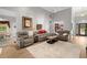 Bright living room with hardwood floors, vaulted ceilings, comfortable seating, and abundant natural light at 9634 Coastal Pointe Dr, Villa Rica, GA 30180
