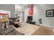 Open living space with hardwood floors, comfortable seating, and decorative artwork for a welcoming atmosphere at 9634 Coastal Pointe Dr, Villa Rica, GA 30180