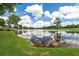 The pond offers a stunning view on a sunny day, reflecting the sky's colors at 9634 Coastal Pointe Dr, Villa Rica, GA 30180