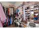 Spacious walk-in closet with ample storage for clothing and shoes at 9634 Coastal Pointe Dr, Villa Rica, GA 30180