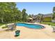 This backyard features an in-ground pool and outdoor dining near the outdoor bar at 180 Moseley Crossing Dr, Stockbridge, GA 30281