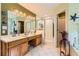 Bathroom featuring a double vanity, glass enclosed shower, and tiled floors at 180 Moseley Crossing Dr, Stockbridge, GA 30281