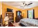 Cozy bedroom with a ceiling fan, a large window, and ample storage at 180 Moseley Crossing Dr, Stockbridge, GA 30281