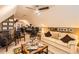 A spacious carpeted bonus room with a seating area and an office setup at 180 Moseley Crossing Dr, Stockbridge, GA 30281