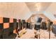 Carpeted bonus room is used as a recording studio with music equipment at 180 Moseley Crossing Dr, Stockbridge, GA 30281