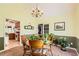 Light-filled dining room featuring a wooden table and chairs, stylish chandelier, and views of the kitchen at 180 Moseley Crossing Dr, Stockbridge, GA 30281