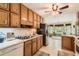 Spacious kitchen featuring ample cabinetry, modern appliances, and a view into the bright breakfast nook at 180 Moseley Crossing Dr, Stockbridge, GA 30281