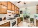 Well-equipped kitchen with abundant cabinet space, white countertops, and an adjoining dining area at 180 Moseley Crossing Dr, Stockbridge, GA 30281