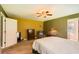 Bright and airy bedroom with a ceiling fan, plush carpet, and natural light at 180 Moseley Crossing Dr, Stockbridge, GA 30281