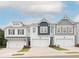 Newly built townhomes featuring varied exterior finishes and attached garages at 2686 Ne Almand Ne Ln, Conyers, GA 30013