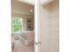 Hallway view of bedroom and closet, featuring neutral tones and natural light at 2686 Ne Almand Ne Ln, Conyers, GA 30013