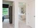 Hallway showing a view into two bedrooms with coordinated decor and plush carpeting at 2686 Ne Almand Ne Ln, Conyers, GA 30013