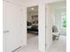 Hallway view with bedroom and possible sitting room, showcasing neutral tones and ample natural light at 2686 Ne Almand Ne Ln, Conyers, GA 30013