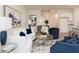 Bright living room featuring stylish blue accent chairs, a white couch, and modern decor at 2686 Ne Almand Ne Ln, Conyers, GA 30013