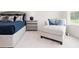 Bright main bedroom with a comfortable seating area and tasteful decor with blue accents at 2686 Ne Almand Ne Ln, Conyers, GA 30013
