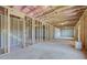 Unfinished basement with exposed ceiling and framed walls at 100 Homesite Valleyview Ct, Mcdonough, GA 30252