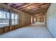 Unfinished basement featuring large windows, exposed ceiling, and framed walls at 100 Homesite Valleyview Ct, Mcdonough, GA 30252