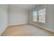 Cozy bedroom with hardwood floors and natural light from large windows at 100 Homesite Valleyview Ct, Mcdonough, GA 30252