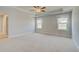 Large bedroom featuring carpeted floors, a ceiling detail, and two windows at 100 Homesite Valleyview Ct, Mcdonough, GA 30252