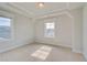 Bright bedroom with carpet, crown molding, and natural light from two windows at 100 Homesite Valleyview Ct, Mcdonough, GA 30252