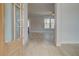 Inviting entryway with natural light, neutral walls, and stylish light wood-look flooring at 100 Homesite Valleyview Ct, Mcdonough, GA 30252