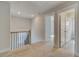 Hallway with carpeted floors, doors to rooms, and natural light at 100 Homesite Valleyview Ct, Mcdonough, GA 30252