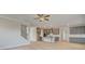 Open-concept kitchen with gray cabinetry, island seating, and modern appliances at 100 Homesite Valleyview Ct, Mcdonough, GA 30252