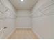An empty walk-in closet featuring neutral walls and wire shelving at 100 Homesite Valleyview Ct, Mcdonough, GA 30252