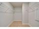 View of a walk-in closet with neutral walls and wire shelving at 100 Homesite Valleyview Ct, Mcdonough, GA 30252
