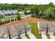 Newer construction townhomes feature attached garages and manicured lawns at 2170 Trelipe Dr, Lawrenceville, GA 30044