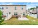Spacious backyard with a patio area, green lawn, and manicured landscaping for outdoor enjoyment at 2170 Trelipe Dr, Lawrenceville, GA 30044