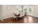 Bright dining area features a wooden table with upholstered chairs and access to the backyard, perfect for entertaining at 2170 Trelipe Dr, Lawrenceville, GA 30044