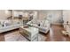 Open-concept living space showcases a harmonious blend of the living room, kitchen, and dining area for seamless living at 2170 Trelipe Dr, Lawrenceville, GA 30044