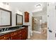 Bathroom features a double vanity, glass shower, and a luxurious soaking tub at 3635 E Paces Ne Cir # 1405, Atlanta, GA 30326
