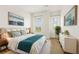 A comfortable bedroom features two windows, a bed, and a chest of drawers at 3635 E Paces Ne Cir # 1405, Atlanta, GA 30326