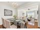 Formal dining area with glass table, seating for six, and views into the living room at 3635 E Paces Ne Cir # 1405, Atlanta, GA 30326