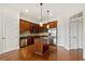 Stylish kitchen features stainless steel appliances, center island, granite countertops, and ample cabinetry at 3635 E Paces Ne Cir # 1405, Atlanta, GA 30326