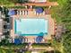 Aerial view of a luxurious community pool with lounge chairs and umbrellas at 3635 E Paces Ne Cir # 1405, Atlanta, GA 30326