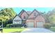 Charming two-story brick home featuring a two-car garage and well-manicured landscaping at 532 Mount Gerizim Se Rd, Mableton, GA 30126