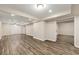 Spacious finished basement with wood flooring and bright recessed lighting; ideal for recreation or additional living space at 10545 Virginia Pine Ln, Alpharetta, GA 30022