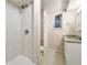 Bathroom featuring a stand-up shower with marble tile and single sink vanity with granite countertops at 10545 Virginia Pine Ln, Alpharetta, GA 30022