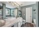 Bathroom featuring modern vanity, bathtub, and coordinated accessories at 142 Holly Mill Village Dr, Canton, GA 30114