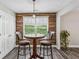 Cozy breakfast nook with decorative wood wall and a window at 142 Holly Mill Village Dr, Canton, GA 30114