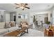 Open concept living room with lots of natural light, modern decor, and hardwood floors at 142 Holly Mill Village Dr, Canton, GA 30114