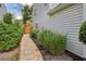 Side yard walkway with stepping stones and decorative landscaping for added curb appeal at 142 Holly Mill Village Dr, Canton, GA 30114