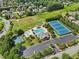 Aerial view of community amenities including pool, tennis courts, basketball court, and green space at 2452 Stone Manor Ne Dr, Buford, GA 30519