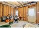 Unfinished basement area features framed walls, exposed ceiling, and utility access, ready for custom finishing at 2452 Stone Manor Ne Dr, Buford, GA 30519
