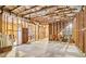 Vast unfinished basement area features exposed ceiling and wood frames, offering customization options at 2452 Stone Manor Ne Dr, Buford, GA 30519