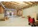 Huge unfinished basement features concrete floor, exposed ceiling, and wood frames, ideal for custom finish at 2452 Stone Manor Ne Dr, Buford, GA 30519